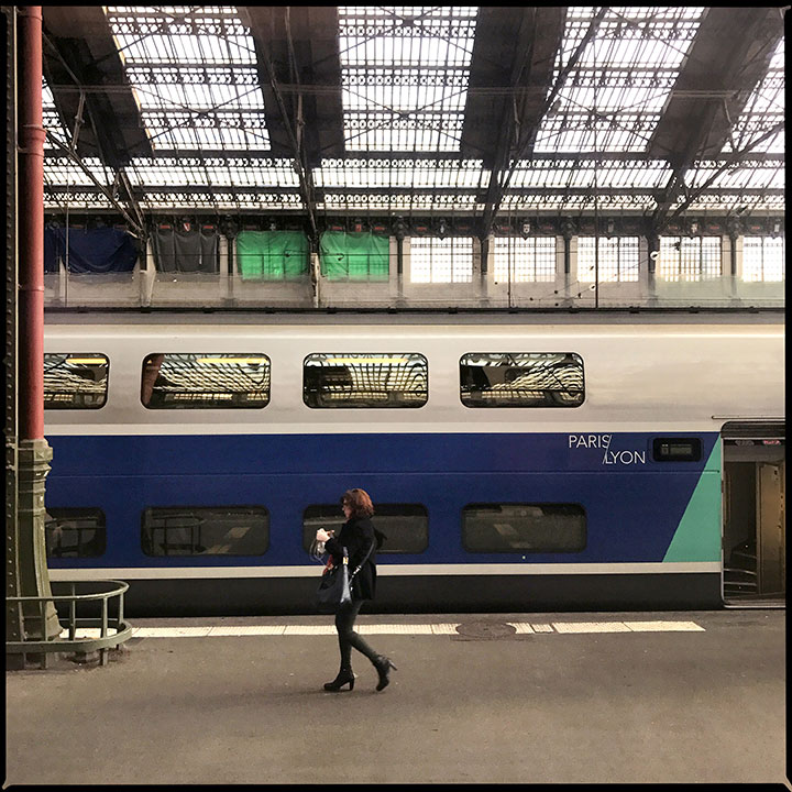 woman walks by at Gare de l'Est train station in Paris, France