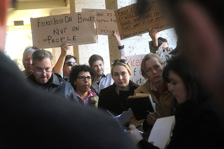 Occupy Austin participants protest a foreclosure auction at the Travis County Courthouse