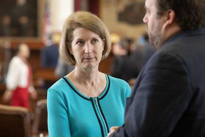 State Representative Vikki Goodwin listens to a colleague during the 87th Texas Legislature 