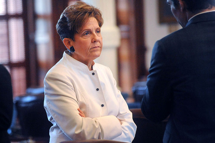 State Representative Linda Koop listens to a colleague during the 84th Texas Legislature