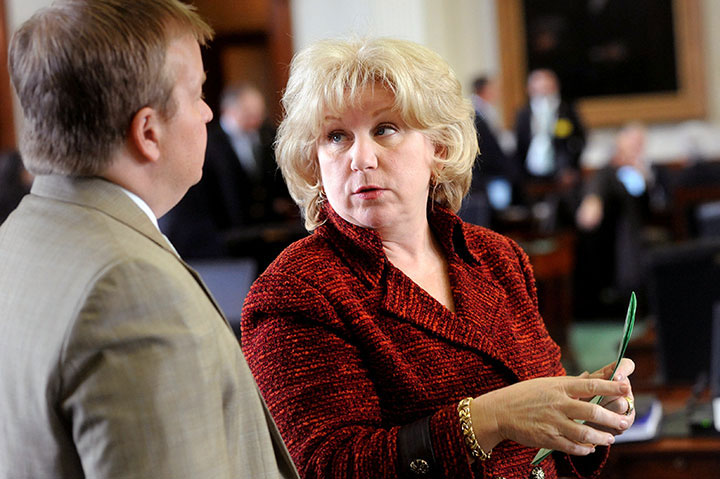 State Senator Jane Nelson speaks with a colleague on the Senate floor during the 82th Texas Legislature