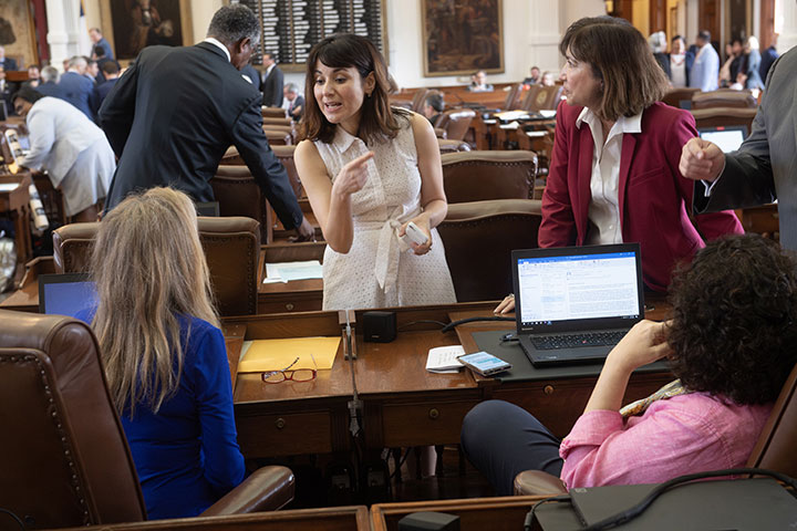 State Representative Gina Hinojosa speaks with colleagues during the 86th Texas Legislature