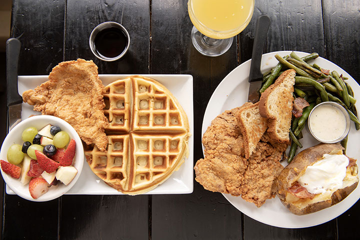 Fried chicken with waffle and chicken fried steak at Wilder Wood