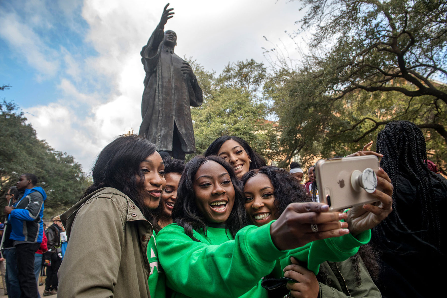 Attendees at an annual Martin Luther King, Jr Day march take a selfie at The University of Texas at Austin