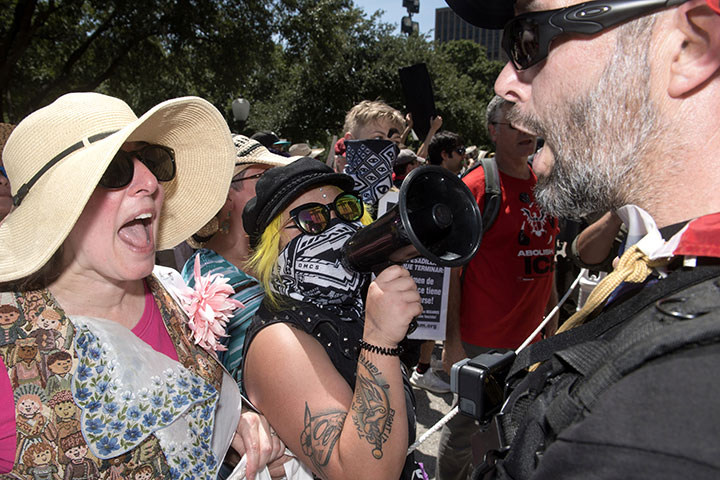 Opposing protesters face off during a rally at the Texas State Capitol